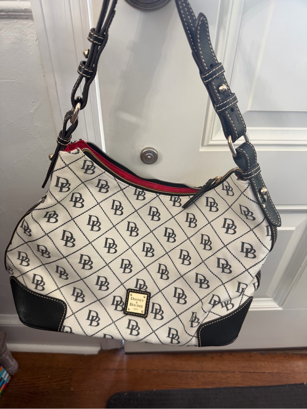 Dooney & Bourke White Shoulder Bag with Black Trim and Red Interior Accent